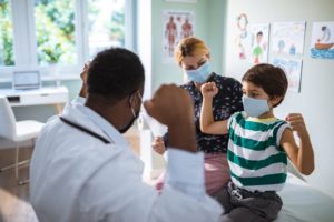 A Close Up Of A Pediatrician Performing An Annual Check Up On A Patient  